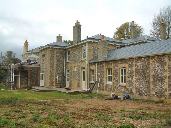 Buff brick flint house
