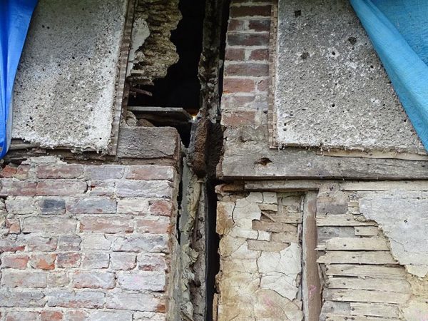 Cottage wattle daub panels before repair