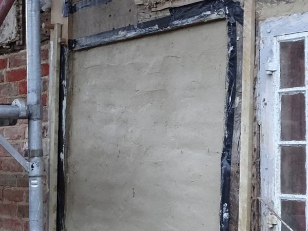 Wattle daub panels repair in progress