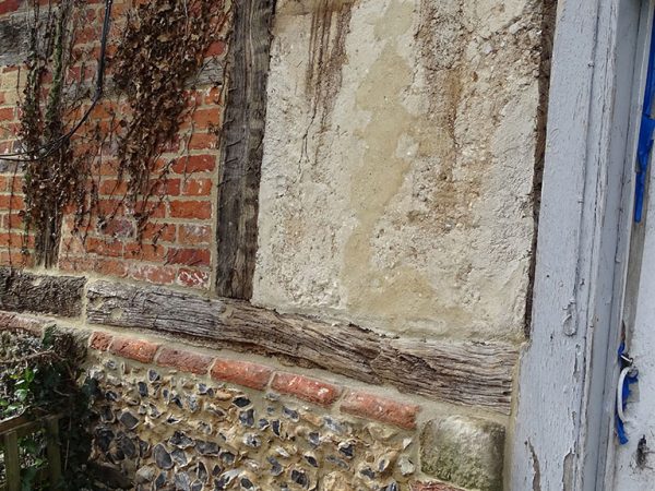 Wattle daub panels repair completed